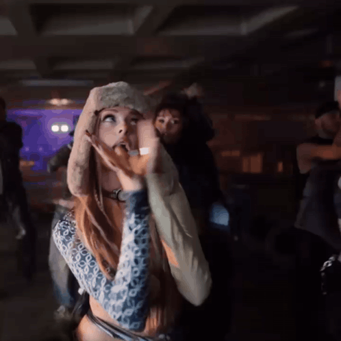 Woman in Furry Hat and Watch Dancing