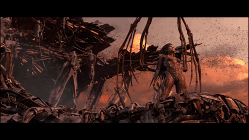 Woman in Futuristic Outfit Before Destroyed Structure