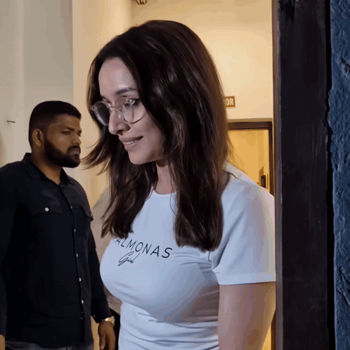 Woman in Glasses and Almonas T-Shirt