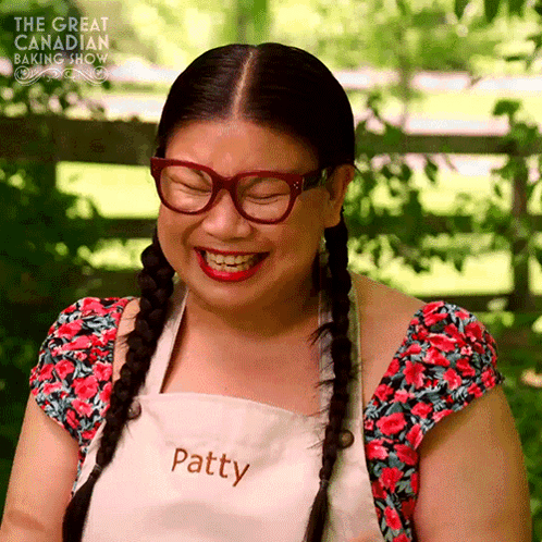 Woman In Glasses And Apron With Patty GIF