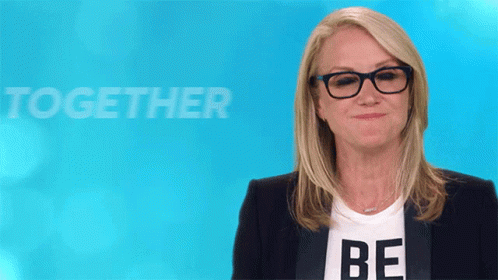 Woman in Glasses and Be Shirt