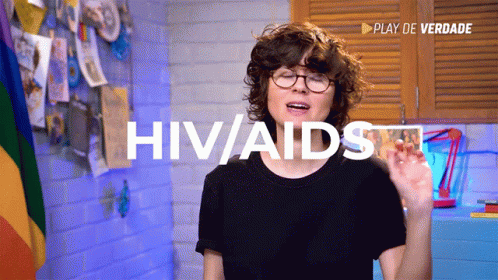 Woman In Glasses And Black Shirt Says HIV/AIDS GIF