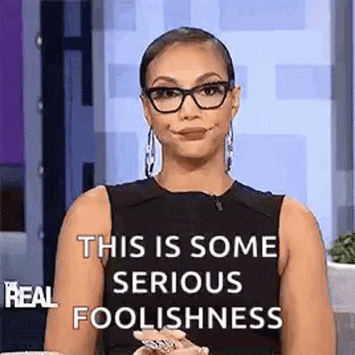 Woman In Glasses And Black Tank Top Making Funny Face GIF