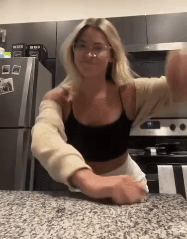 Woman in Glasses and Black Tank Top Standing in Kitchen