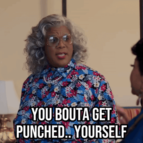 Woman In Glasses And Floral Shirt Saying You Bouta Get Punched Yourself GIF
