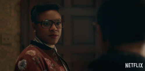 Woman in Glasses and Floral Sweater Says Look Netflix