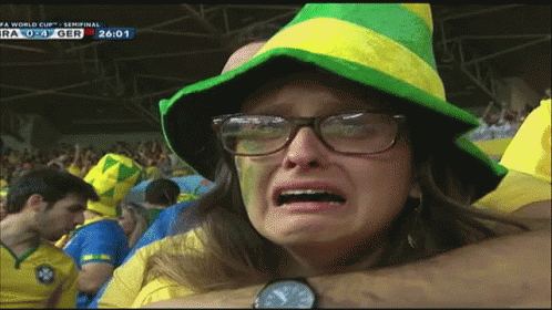 Woman In Glasses And Hat Crying At FIFA World Cup Screen GIF