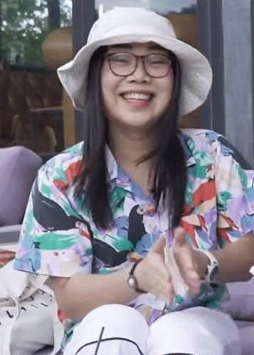 Woman In Glasses And Hat Smiling And Clapping GIF