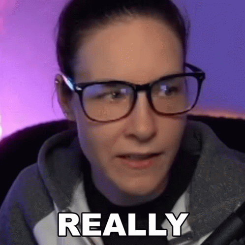 Woman in Glasses and Hoodie Saying Really