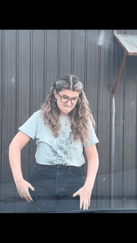 Woman in Glasses and Light Blue Shirt