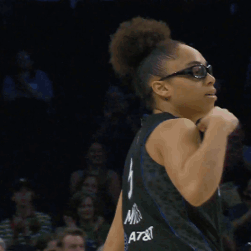Woman In Glasses And Lynx Jersey Flexing Arm GIF