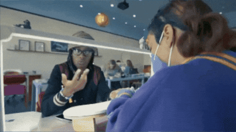 Woman In Glasses And Mask Looking In Mirror GIF
