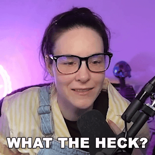 Woman in Glasses and Overalls Says What The Heck