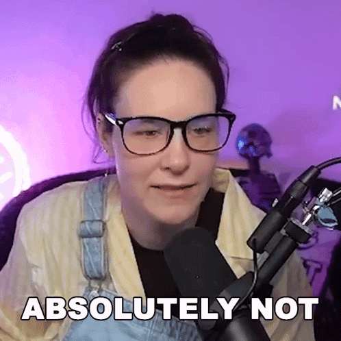 Woman in Glasses and Overalls Sitting in Front of Microphone Absolutely Not