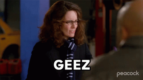 Woman In Glasses And Scarf Saying Geez To Man GIF