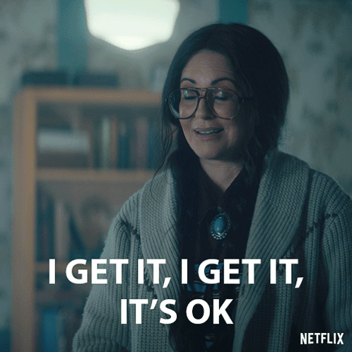 Woman in Glasses and Sweater Says I Get It I Get It It's OK