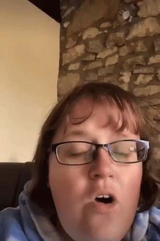 Woman in Glasses Making Open-Mouthed Face