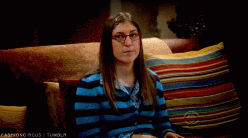 Woman in Glasses on Couch With Colorful Pillows Fashioncircus Tumblr