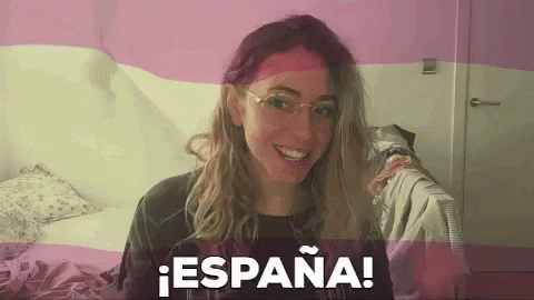 Woman in Glasses Smiling Pink White Flag Espana