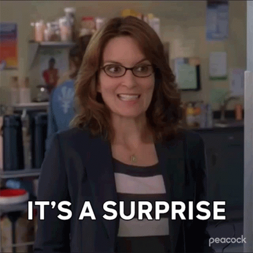 Woman in Glasses Smiling Saying It's a Surprise