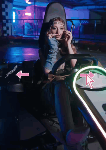 Woman in Go Kart With Pink Arrow Right