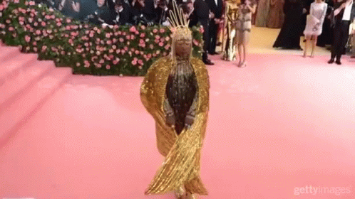 Woman in Gold Dress and Crown