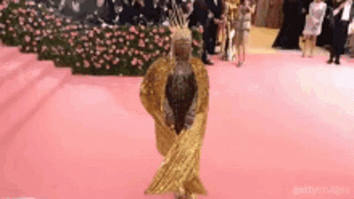 Woman in Gold Dress Dancing