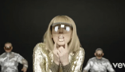 Woman in Gold Sequined Jacket Sunglasses Funny Face