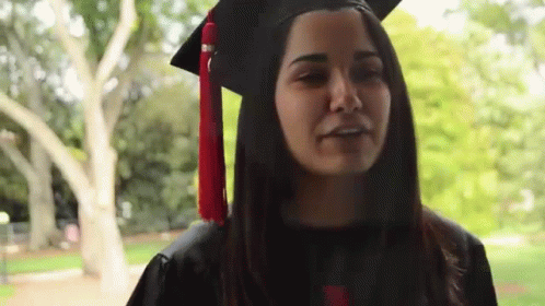 Woman In Graduation Cap And Gown GIF