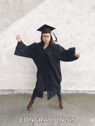 Woman In Graduation Cap And Gown Dancing GIF