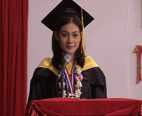 Woman In Graduation Cap And Gown Giving Speech GIF