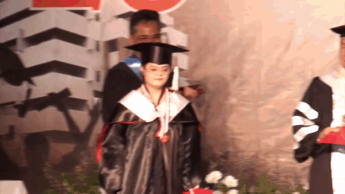Woman In Graduation Cap And Gown GIF