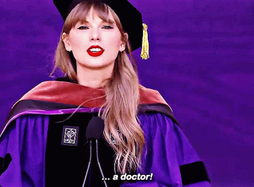 Woman In Graduation Cap And Gown Saying A Doctor GIF