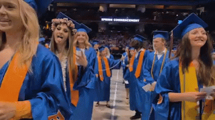 Woman in Graduation Cap and Gown Smiling