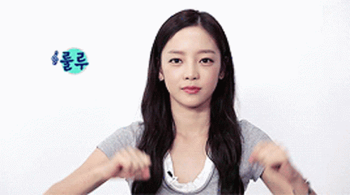 Woman In Gray Shirt Making Funny Face GIF