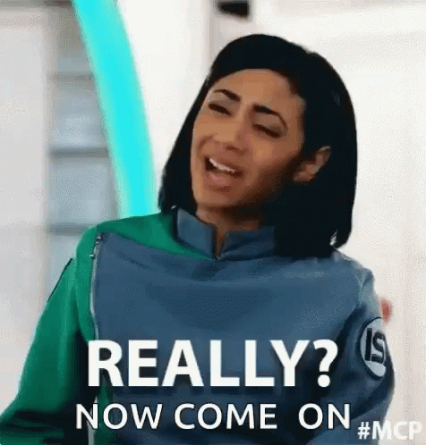 Woman In Green And Blue Jacket Making Funny Face GIF