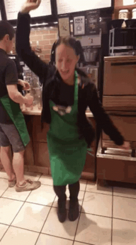 Woman in Green Apron Dancing