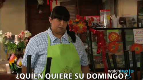 Woman in Green Apron Says Quien Quiere Su Domingo in Restaurant