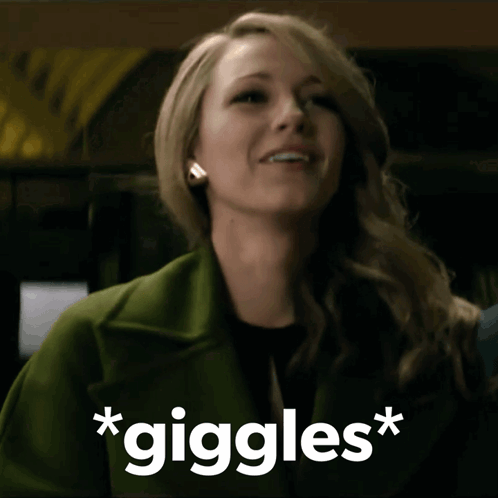 Woman in Green Coat Smiling Giggles