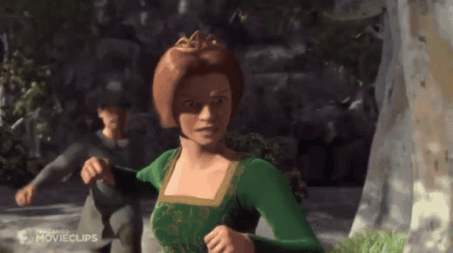 Woman in Green Dress and Crown Running With Man in Black Shirt