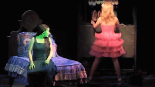 Woman In Green Dress Beside Woman In Pink GIF