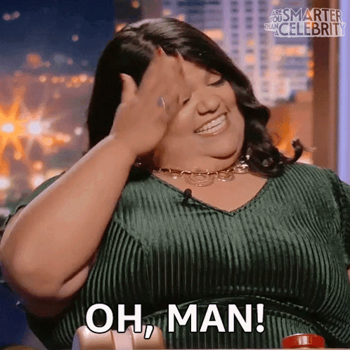 Woman in Green Dress Covering Face Saying Oh Man