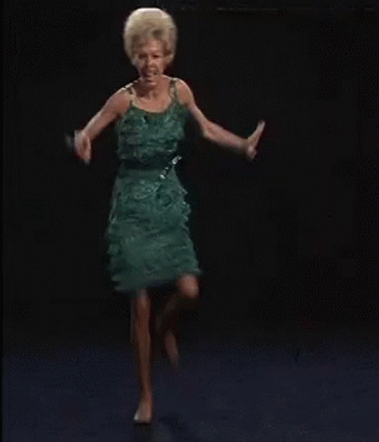 Woman In Green Dress Crazy Dancing GIF