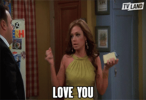 Woman in Green Dress Holding Phone Saying Love You