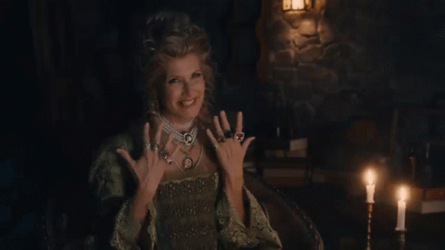 Woman In Green Dress In Candlelit Room GIF