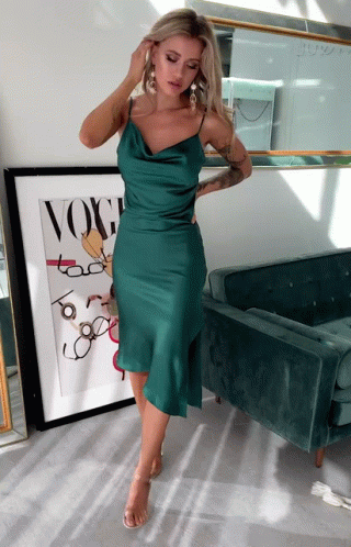 Woman in Green Dress in Front of Vogue