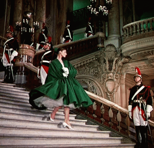 Woman In Green Dress Walking Down Stairs GIF