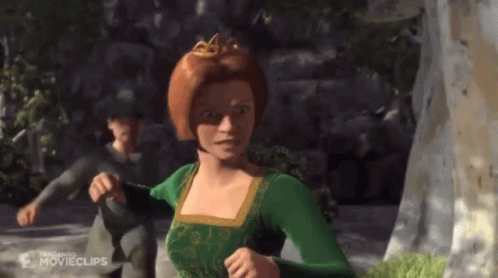 Woman in Green Dress With Crown Running From Man in Gray Shirt