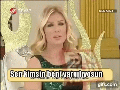 Woman In Green Dress With Sign Sen Kimsin Beni Vargilyosun GIF