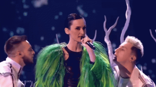 Woman in Green Fur Coat Singing